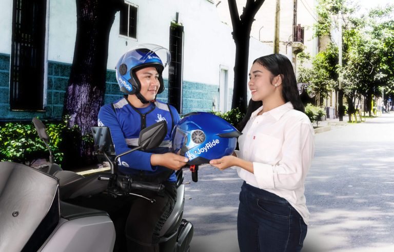 REVISED-BIKER-GIVING-HELMET-TO-FEMALE-CUSTOMER-1-1-1536x981